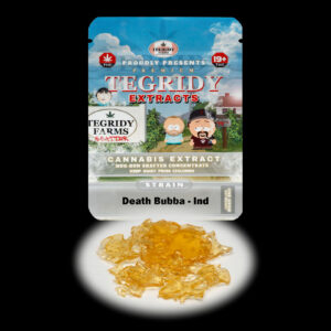 “Tegridy Extracts Death Bubba shatter concentrate featuring translucent light golden shatter with a clear glass-like appearance and stable texture.”